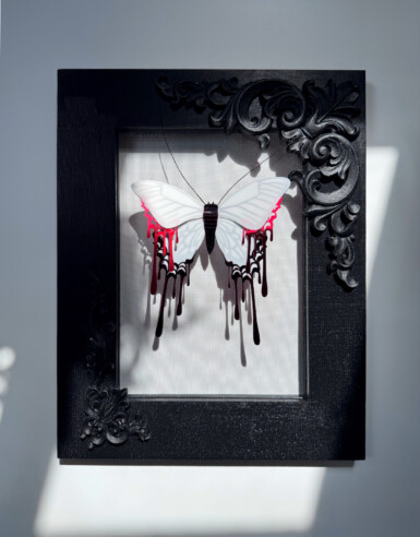 Carnivorous Lunar Activities
2024
12" x 15" (h x w)
Yupo, acetate, sequin film, enamel paint, acrylic paint, thread, ostrich feathers A white moth with dusty black veins seems to drip with blood