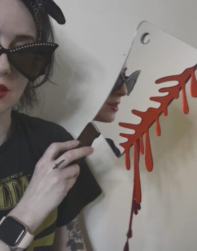 Ambush Blood Test
2025
14" long. The blade is 7.5" long and 5" wide. Including the blood drips – both beaded and acrylic – the height of the piece hanging at the right angle is 13.5"
Acrylic mirror, walnut, brass, thread, beads, paint, pine Ambush Blood Test