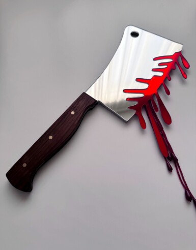Ambush Blood Test
2025
14" long. The blade is 7.5" long and 5" wide. Including the blood drips – both beaded and acrylic – the height of the piece hanging at the right angle is 13.5"
Acrylic mirror, walnut, brass, thread, beads, paint, pine Ambush Blood Test
