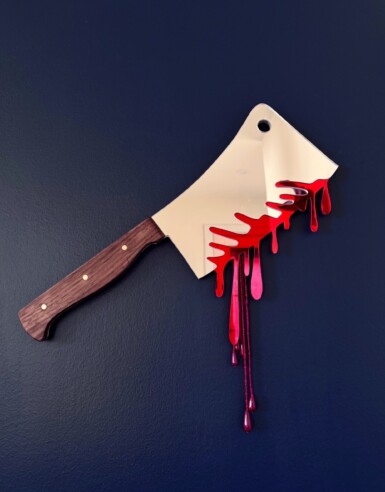 Ambush Blood Test
2025
14" long. The blade is 7.5" long and 5" wide. Including the blood drips – both beaded and acrylic – the height of the piece hanging at the right angle is 13.5"
Acrylic mirror, walnut, brass, thread, beads, paint, pine Ambush Blood Test